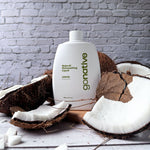 GoNative coconut-based natural dishwashing liquid, lemon, 500ml white refill bottle surrounded by fresh coconuts