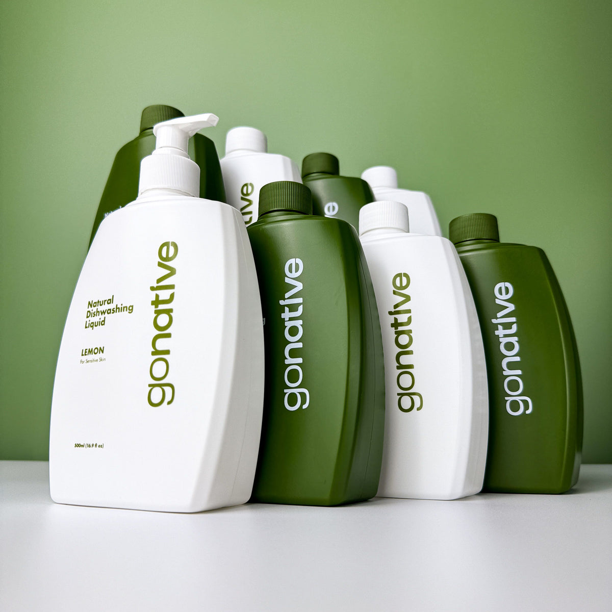 GoNative natural dishwashing liquid 8-pack: 500ml lemon-scented bottles for sensitive skin, in white and green.